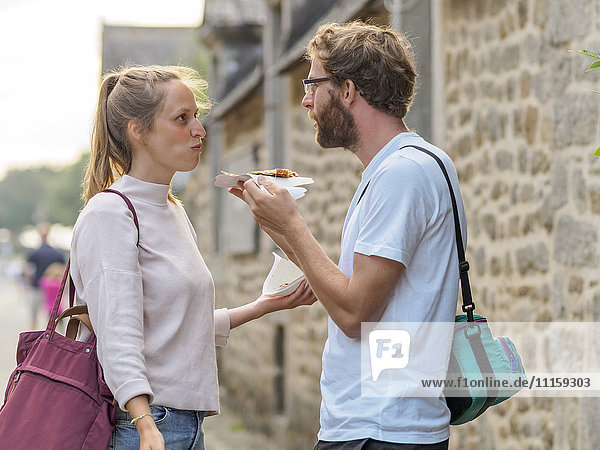 France  Bretagne  young couple eating Crepes