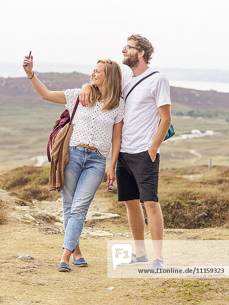 Couple at the beach taking a selfie