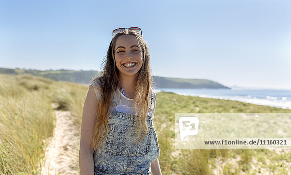 Portrait of happy teenage girl on the beach