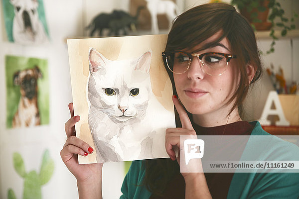 Portrait des Künstlers mit Aquarell einer Katze