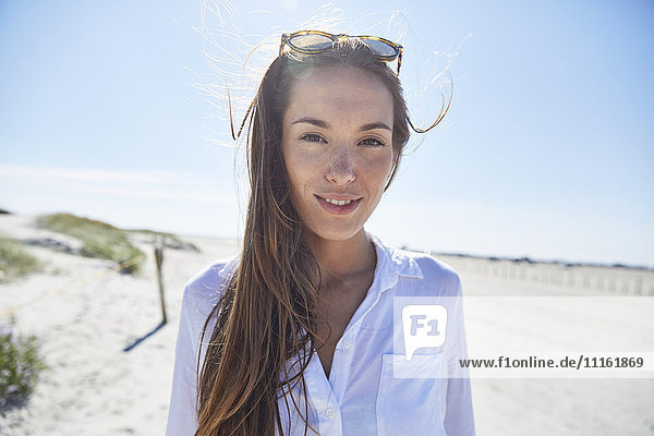 Portrait of young woman on the beach