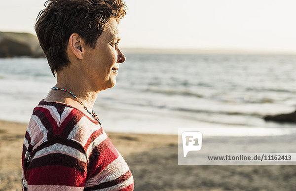 France  Crozon peninsula  Portrait of mature woman at beach