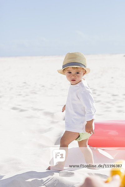 Portrait of a baby boy standing on the beach