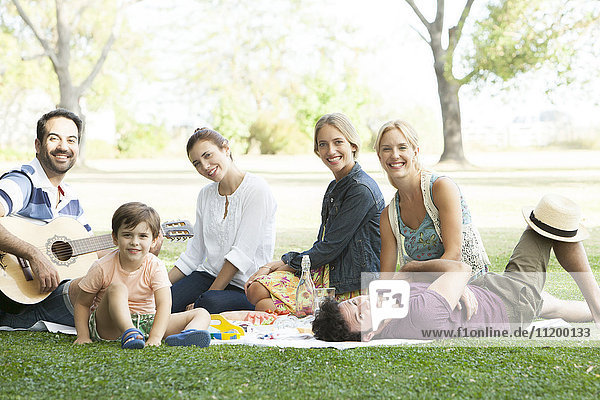 Friends enjoying picnic in park