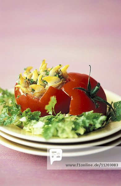 A tomato filled with cockles