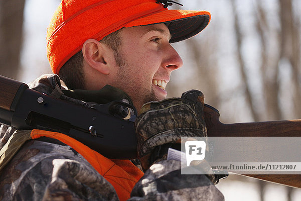 Winter Pheasant Hunter With Shotgun On Shoulder