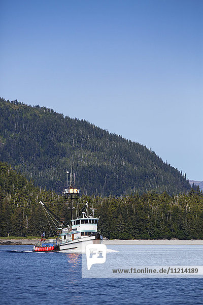 Commercial fishing boat on the waters of Main Bay  Prince William Sound  Whittier  Southcentral Alaska  USA  Summer