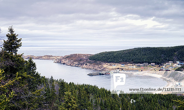 'High view of a cove with beach and harbour along the Canadian atlantic coast; White Point  Nova Scotia  Canada'