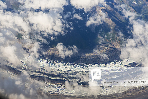 'Aerial view of clouds twisting among the snowy peaks and glaciers of the Alaska Range  interior Alaska; Alaska  United States of America'