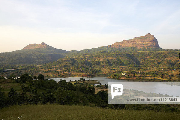 Western Ghats landscape with hills  ruined hill forts and lake