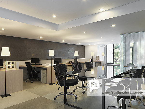 Workspaces and conference table in modern office