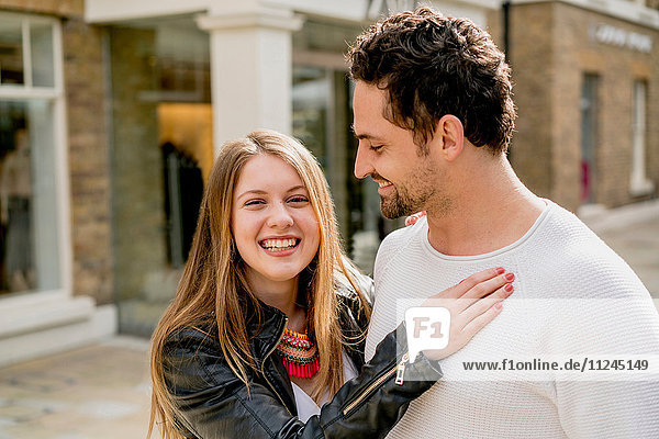 Portrait of happy young couple on Kings Road  London  UK