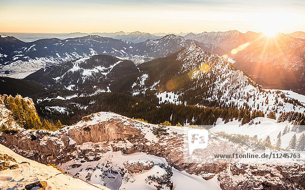 Snow-covered mountain landscape at sunrise Teufelstattkopf mountain Oberammergau Bavaria Germany