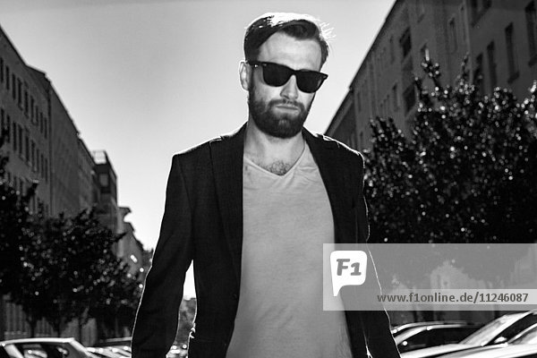 Portrait of man wearing blazer and sunglasses  Berlin  Germany
