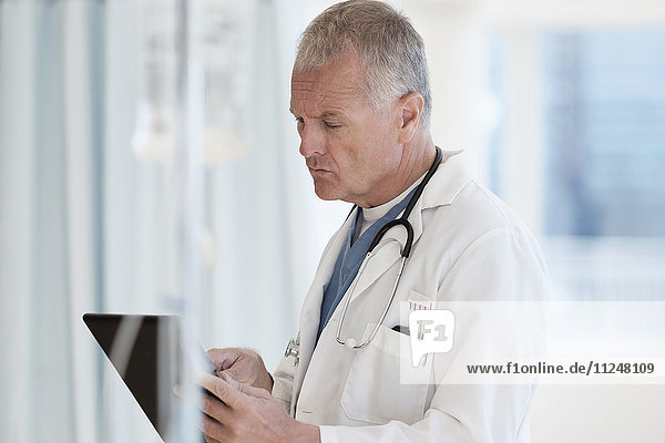 Doctor using tablet in hospital