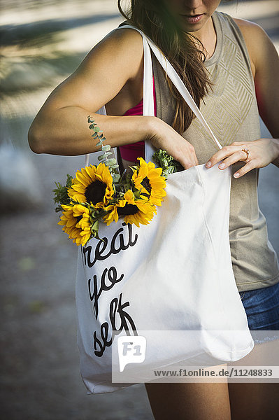 Young woman with shopping bag
