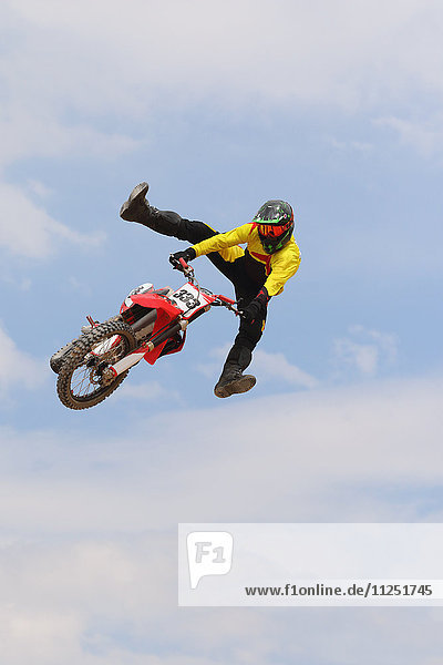 Motocross racer jumping in the air