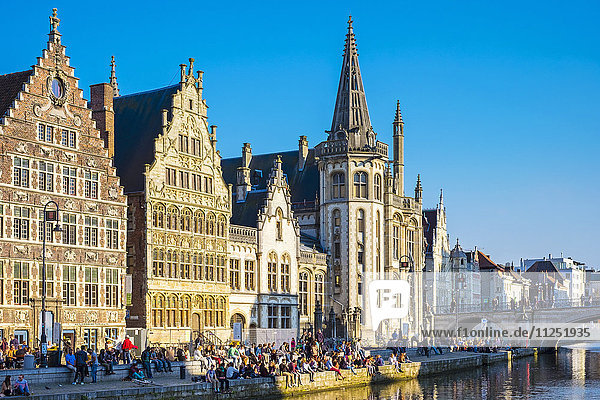 Belgium, Flanders, Ghent (Gent). Medieval guild houses on Graslei and the Leie River.