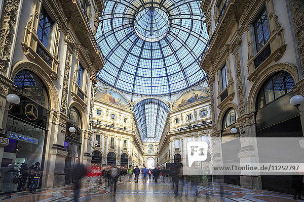 The shopping arcades and the glass dome of the historical Galleria Vittorio Emanuele II  Milan  Lombardy  Italy  Europe