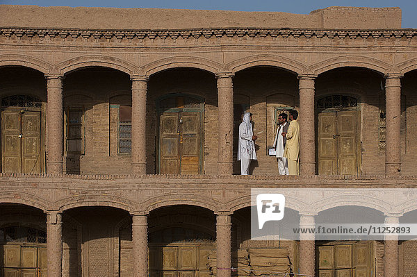 Men standing in the old market in Herat  Afghanistan  Asia