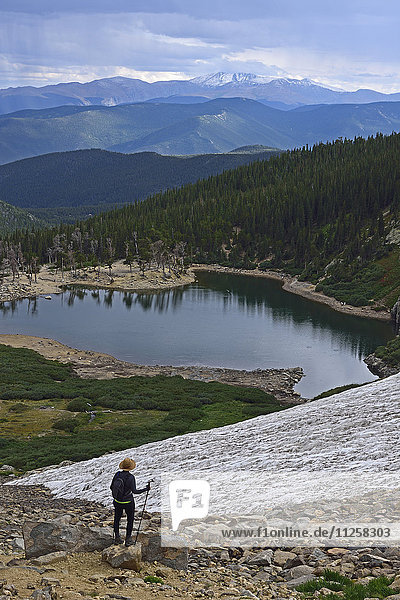 USA  Colorado  Idaho Springs  Hiker looking at view from Saint Mary's Glacier