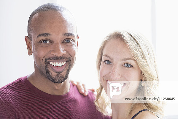 Portrait of happy multi ethnic couple