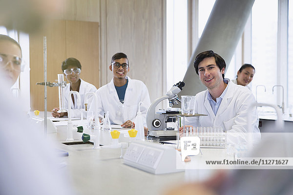 Portrait smiling college students in science laboratory classroom