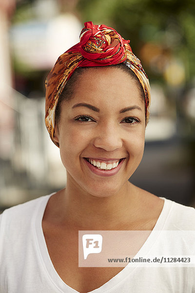 Portrait of smiling Black woman wearing headscarf