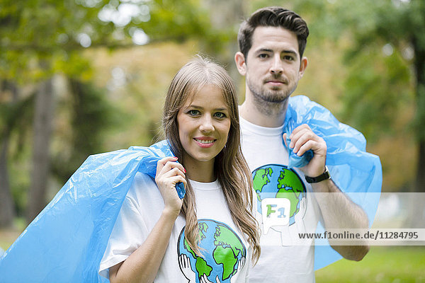 Teenage volunteers doing garbage cleanup in park
