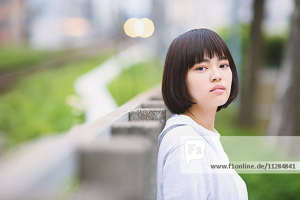 Young Japanese woman portrait outside