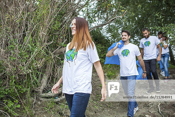 Teenage volunteers doing garbage cleanup in park