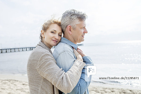 Couple in love embracing on beach