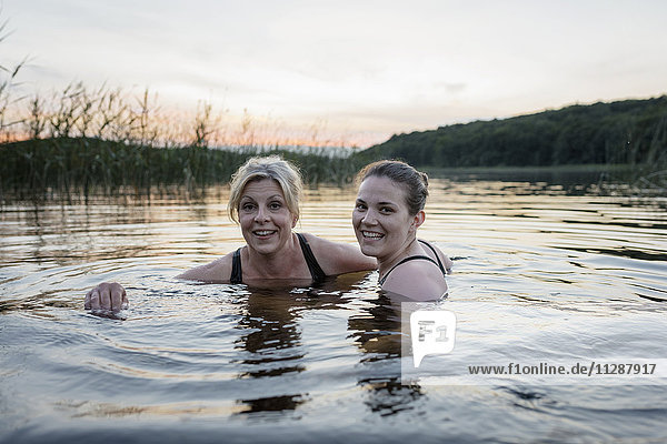 Women swimming in lake