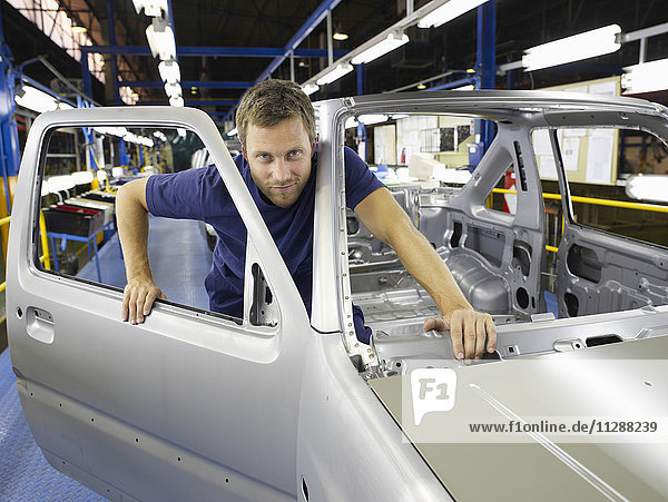 Man Working in Automotive Plant