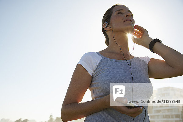 Woman Listening to Mp3 Player
