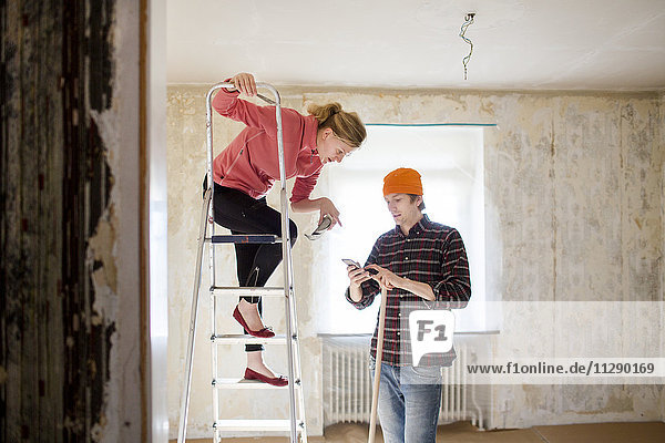 Couple doing house renovation