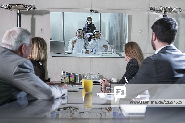 Business people in video conference with clients from the Middle East
