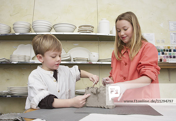 Boy and Girl in Pottery Studio