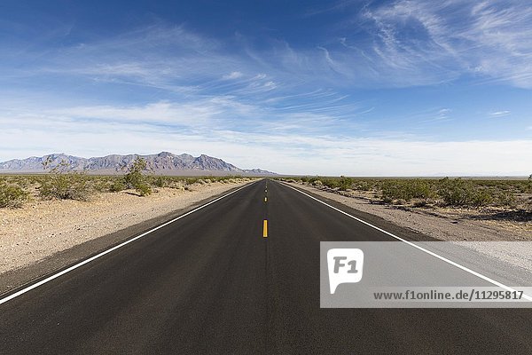 Lonely long road Death Valley National Park California USA North America