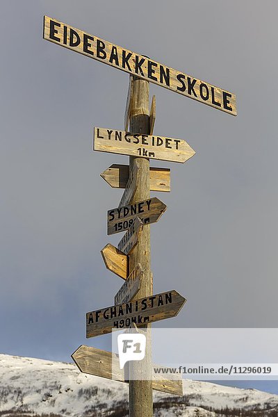 Signpost in all directions  Eidebakken school  Lyngseidet  Lyngen Municipality  Province Troms  Norway  Europe
