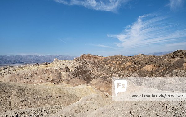Badlands  rock formations at Zabriskie Point  behind Panamint Range  Death Valley National Park  California  USA  North America