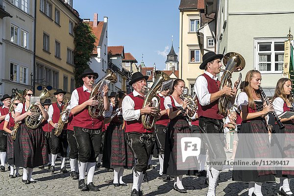 Parade with musical band in traditional costumes  Lindau  Lake Constance  Bavaria  Germany  Europe