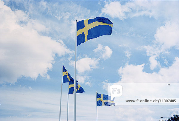 Swedish flags against sky