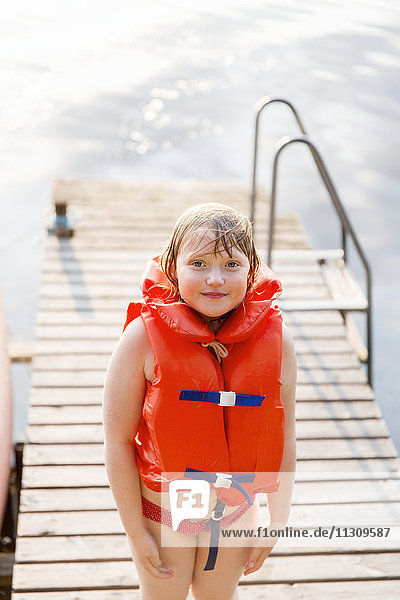 Smiling girl at water