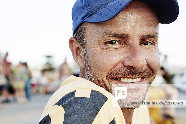 Portrait of smiling man wearing cap