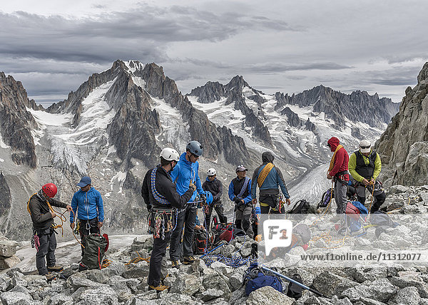 France  Chamonix  Grands Montets  Aiguille d' Argentiere  group of mountaineers preparing