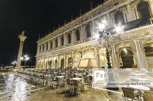 Italy  Venice  deserted pavement cafe on St Mark's Square at night