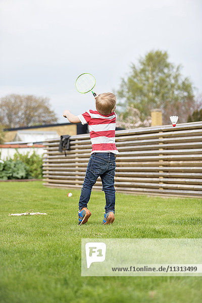 Boy playing badminton