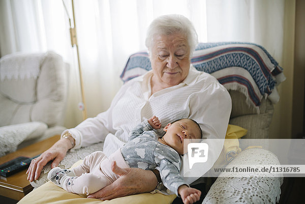 Great grandmother taking care of her great granddaughter at home