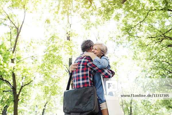 Senior couple embracing in nature
